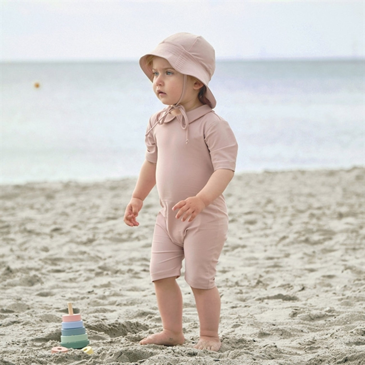 Petit Crabe Rose Nude Palma Onesie with Zipper