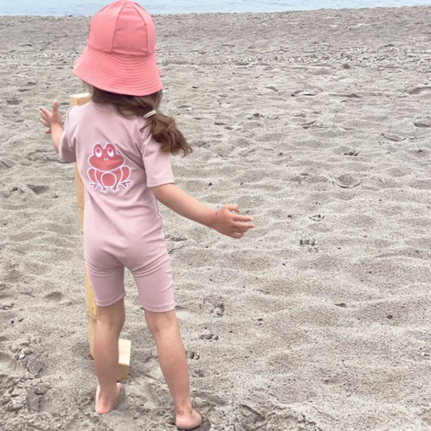 Petit Crabe Rose Nude Noe Frog Sunsuit with Zipper