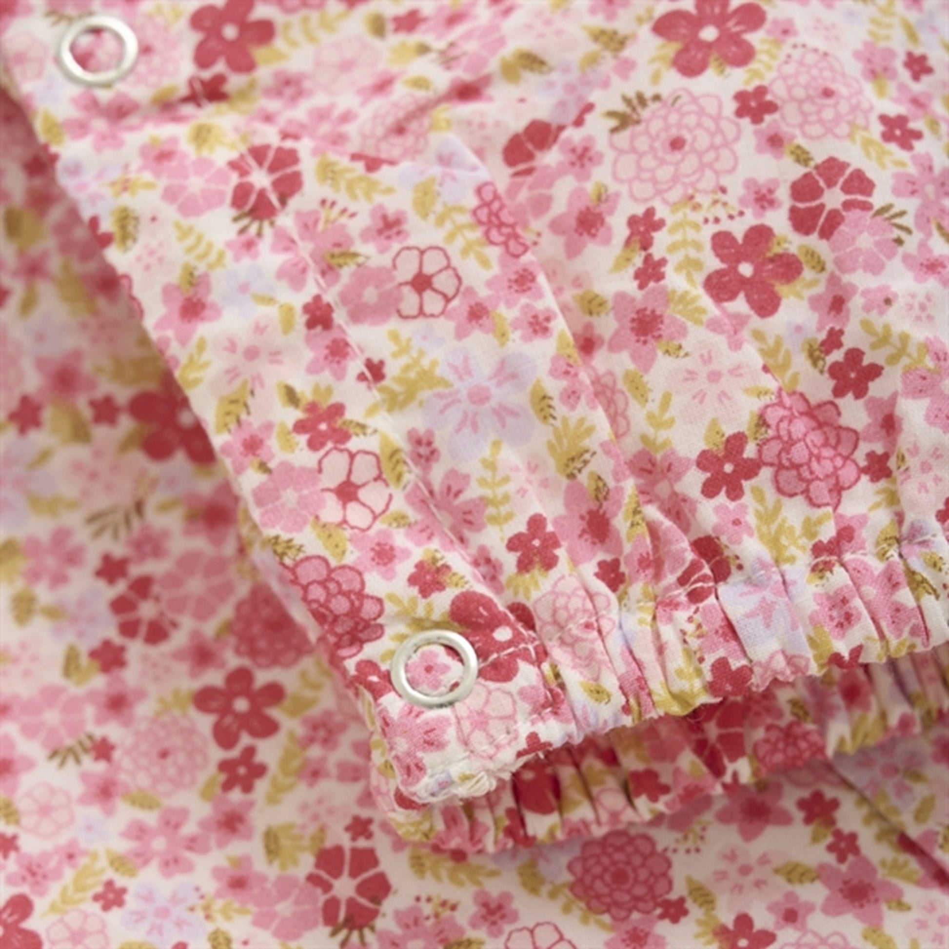 Minymo Pink Dogwood Onesie AOP w. Lining