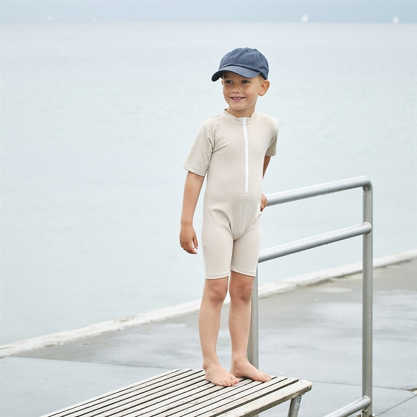 Petit Crabe Latte Noe Onesie with Zipper