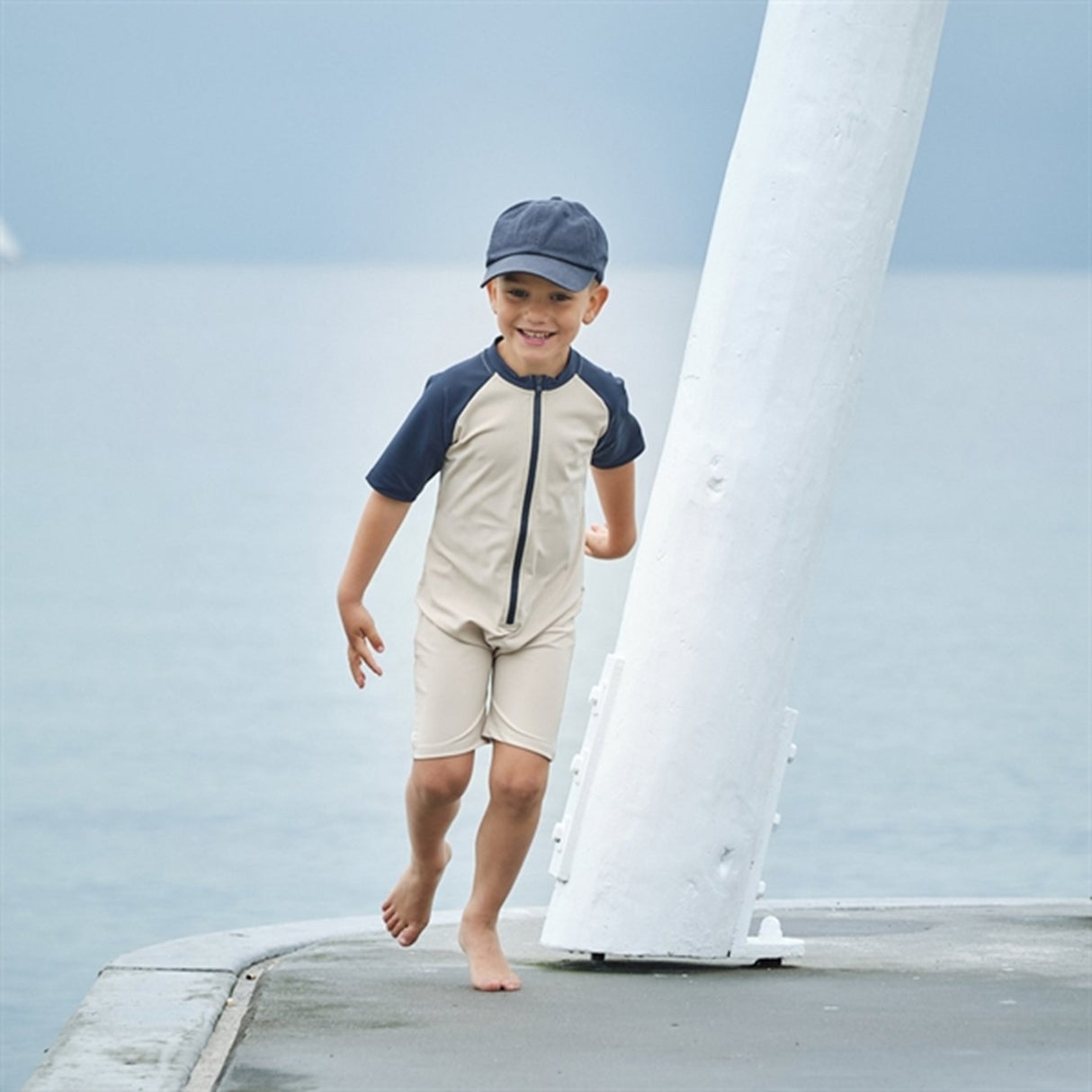 Petit Crabe Latte/Blue Multi Color Onesie with Zipper